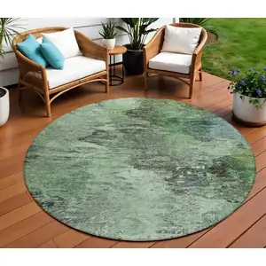 Photo of 8' Green And Brown Round Abstract Washable Indoor Outdoor Area Rug