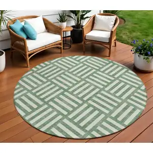 Photo of 8' Green And Ivory Round Geometric Washable Indoor Outdoor Area Rug