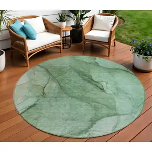 Photo of 8' Green And Sage Round Abstract Washable Indoor Outdoor Area Rug