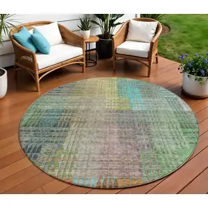 Photo of 8' Green Gold And Teal Blue Round Abstract Washable Indoor Outdoor Area Rug