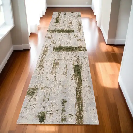 10' Green and Ivory Abstract Power Loom Distressed Runner Rug Photo 1