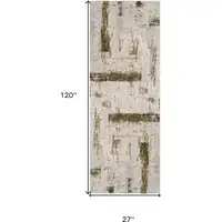 Photo of 10' Green and Ivory Abstract Power Loom Distressed Runner Rug