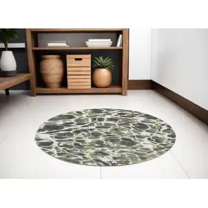 Photo of 5' Green and White Round Abstract Non Skid Area Rug