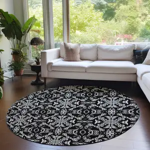 Photo of 8' Ivory And Black Round Medallion Washable Indoor Outdoor Area Rug