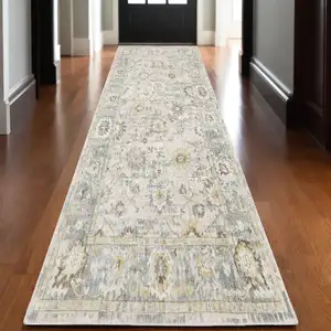 Photo of 10' Ivory And Blue Oriental Hand Tufted Runner Rug