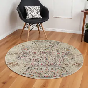 Photo of 6' Ivory And Brown Floral Distressed Round Rug