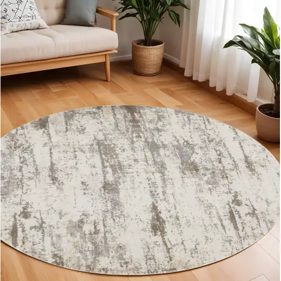 8' Brown and Ivory Abstract Non Skid Round Rug Photo 1