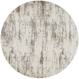 Photo of 8' Ivory And Brown Round Abstract Area Rug