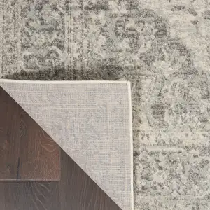 Photo of 7' Ivory And Gray Floral Medallion Distressed Runner Rug