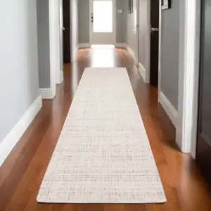 Photo of 8' Ivory And Gray Striped Hand Tufted Runner Rug