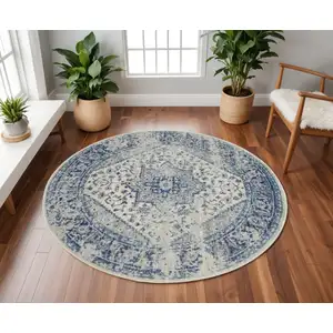 Photo of 8' Ivory And Light Blue Floral Medallion Distressed Round Rug