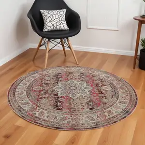 Photo of 6' Ivory And Red Floral Distressed Round Rug