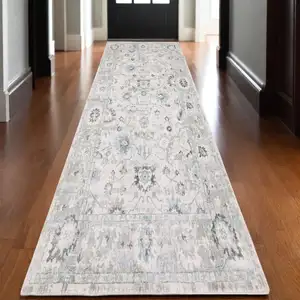 Photo of 10' Ivory And Teal Oriental Hand Tufted Runner Rug