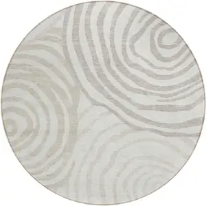 Photo of 8' Ivory Beige And Khaki Round Abstract Washable Indoor Outdoor Area Rug