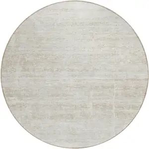 Photo of 8' Ivory Beige And Tan Round Abstract Washable Indoor Outdoor Area Rug