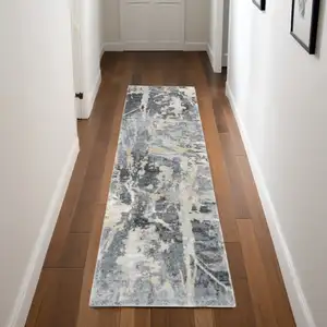 Photo of 8' Ivory Black and Gray Abstract Distressed Runner Rug