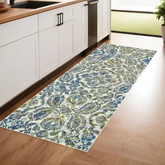 8' Ivory Blue And Green Floral Stain Resistant Runner Rug Photo 1