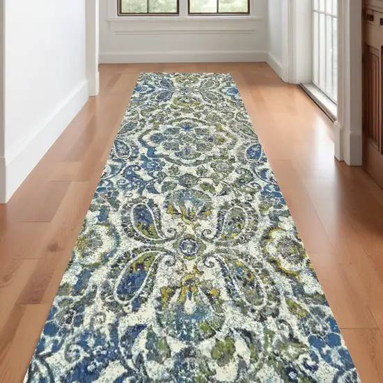 10' Ivory Blue And Green Floral Stain Resistant Runner Rug Photo 1