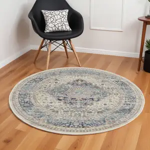 Photo of 6' Ivory Blue And Orange Floral Distressed Round Rug