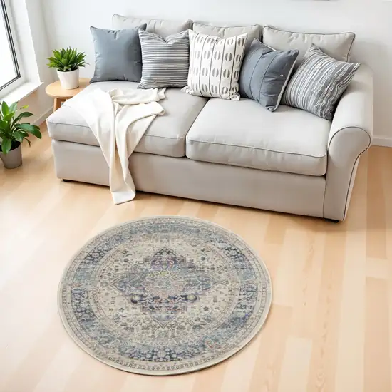 4' Ivory Blue And Orange Floral Distressed Round Rug Photo 1