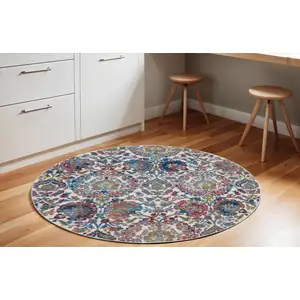 Photo of 6' Ivory Blue and Gray Floral Distressed Non Skid Round Rug