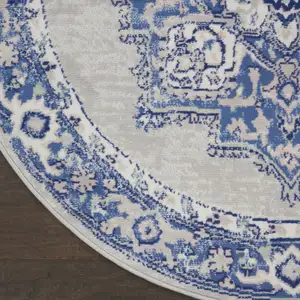 Photo of 5' Ivory Blue and Gray Floral Round Rug