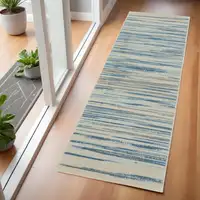 Photo of 6' Ivory Blue and Gray Striped Non Skid Runner Rug