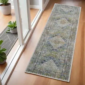 Photo of 6' Ivory Blue and Green Floral Distressed Non Skid Runner Rug