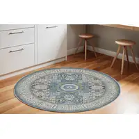 Photo of 6' Ivory Blue and Green Oriental Distressed Non Skid Round Rug