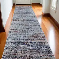 Photo of 10' Ivory Blue and Orange Abstract Power Loom Runner Rug