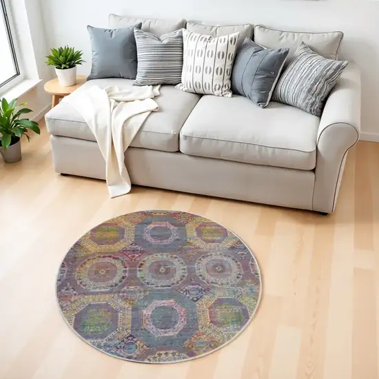 4' Ivory Blue and Orange Geometric Distressed Non Skid Round Rug Photo 1