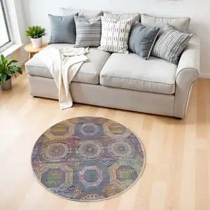 Photo of 4' Ivory Blue and Orange Geometric Distressed Non Skid Round Rug