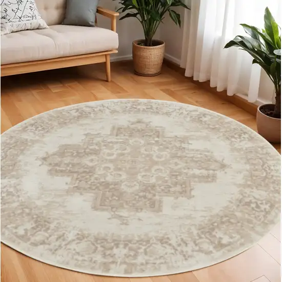 8' Ivory Floral Power Loom Round Rug Photo 1