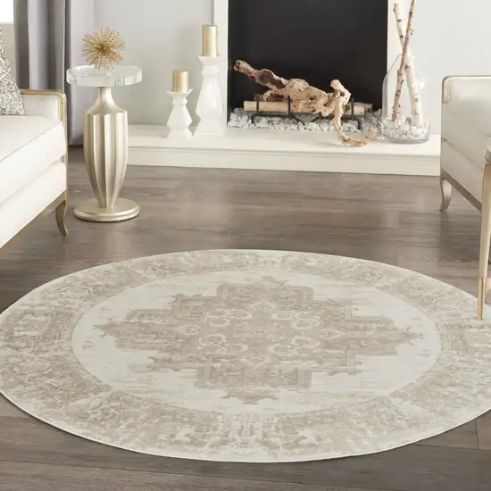 8' Ivory Floral Power Loom Round Rug Photo 9