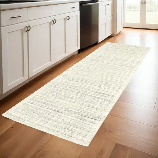 8' Ivory Geometric Hand Woven Runner Rug Photo 1