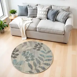 Photo of 4' Ivory Gray And Blue Botanical Leaves Round Rug