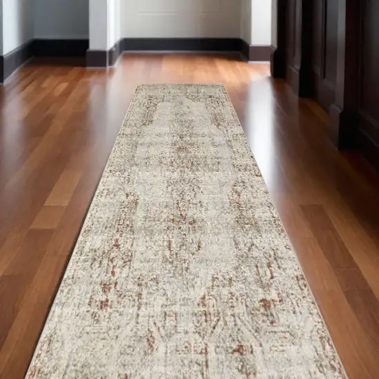 10' Ivory Gray and Brown Abstract Power Loom Worn Faded Runner Rug With Fringe Photo 1