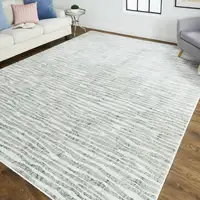 Photo of 8' Ivory Gray and Green Abstract Power Loom Worn Faded Runner Rug