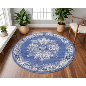 Photo of 8' Ivory Navy Blue and Beige Floral Medallion Round Rug