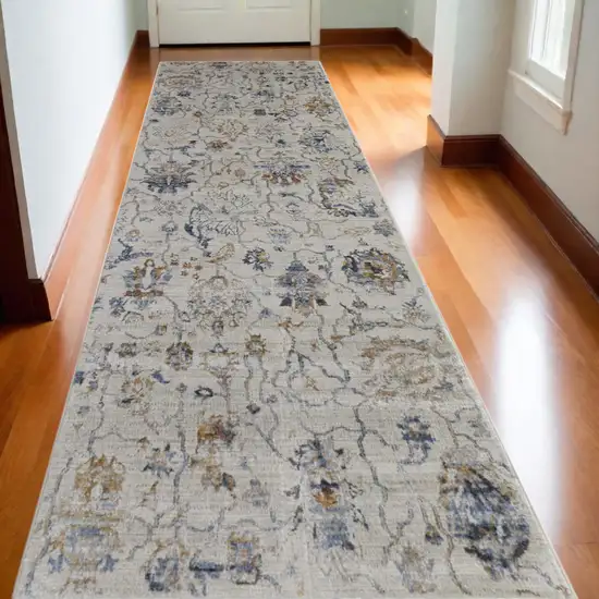 10' Ivory and Blue Floral Power Loom Distressed Non Skid Runner Rug Photo 1