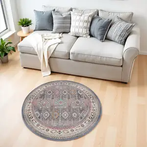 Photo of 4' Ivory Pink And Gray Floral Distressed Round Rug