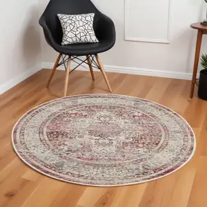 Photo of 6' Ivory Red And Brown Floral Distressed Round Rug