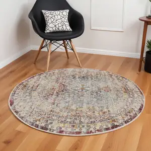 Photo of 6' Ivory Red And Orange Geometric Distressed Round Rug