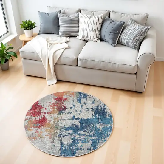 4' Ivory Red and Blue Abstract Distressed Non Skid Round Rug Photo 1