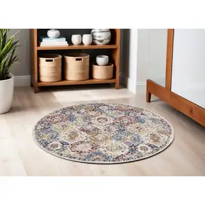 Photo of 5' Ivory Red and Blue Ogee Distressed Non Skid Round Rug