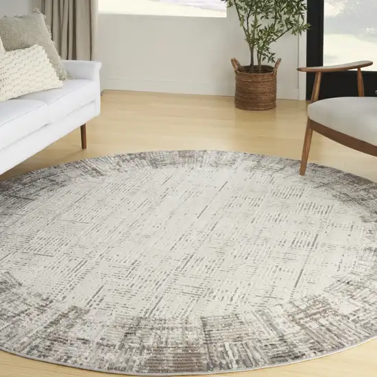 8' Ivory Round Abstract Power Loom Area Rug Photo 4