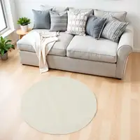 Photo of 4' Ivory Shag Round Rug