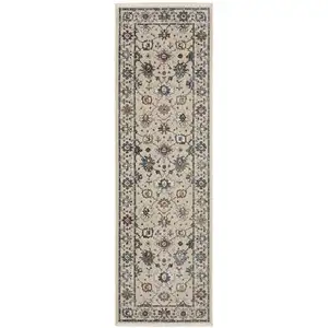 Photo of 8' Ivory Tan And Blue Floral Runner Rug With Fringe