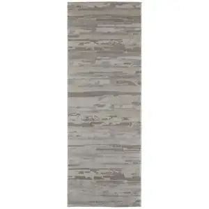 Photo of 8' Ivory Tan And Brown Abstract Power Loom Distressed Stain Resistant Runner Rug