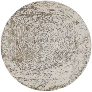 Photo of 8' Ivory Tan And Gray Round Abstract Area Rug